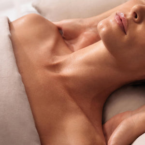 Close-up of a person lying down with a neutral background