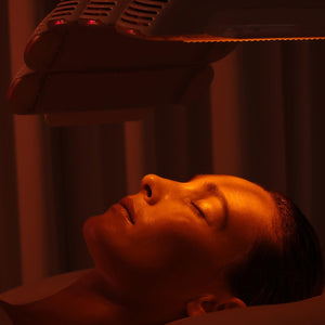 client under LED red light