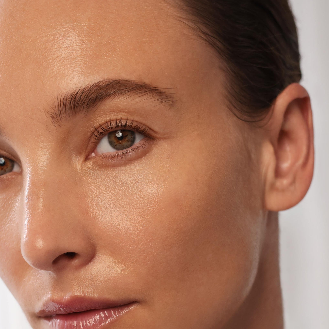 Close-up of a woman's face with a neutral background